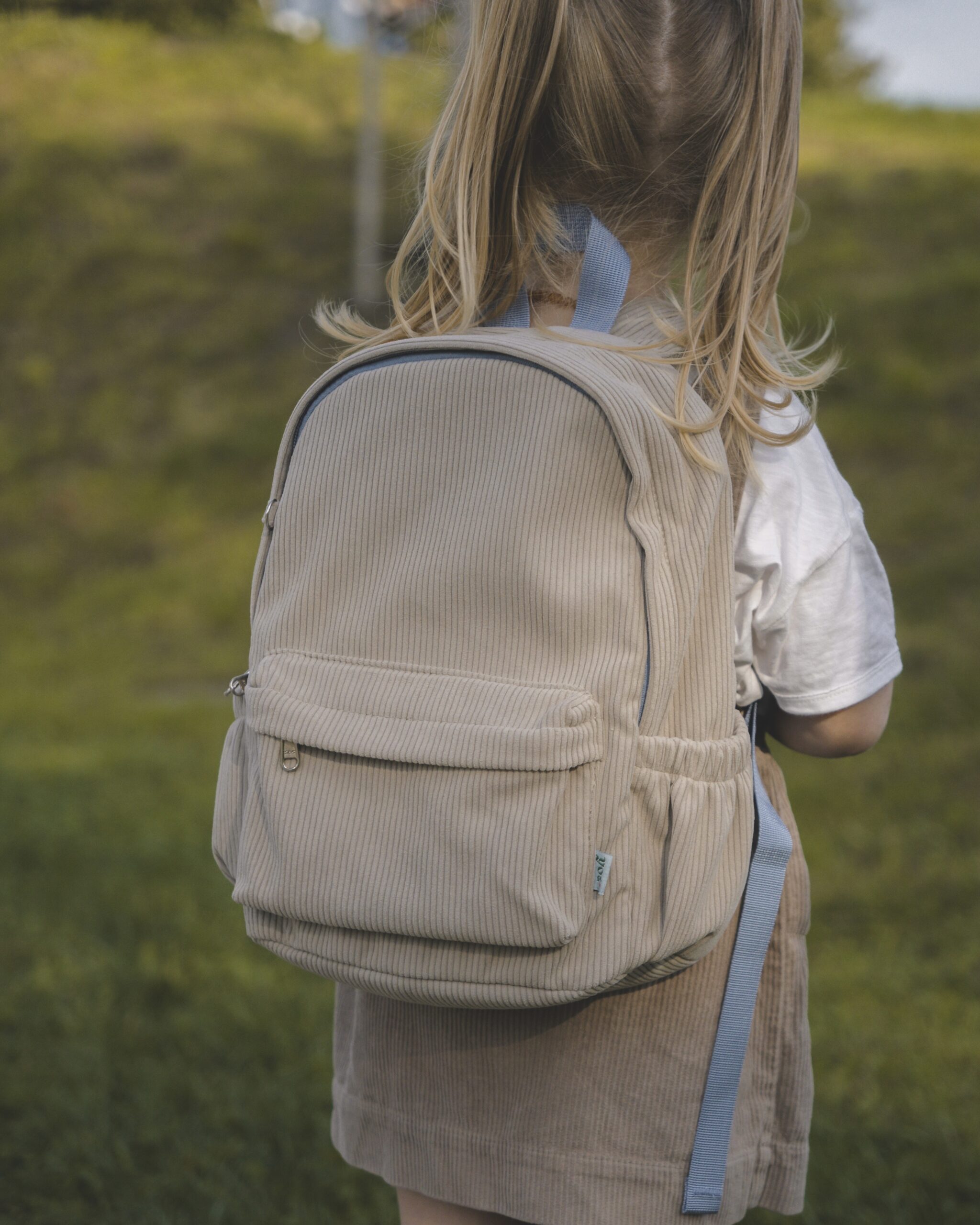 small beige corduroy backpack